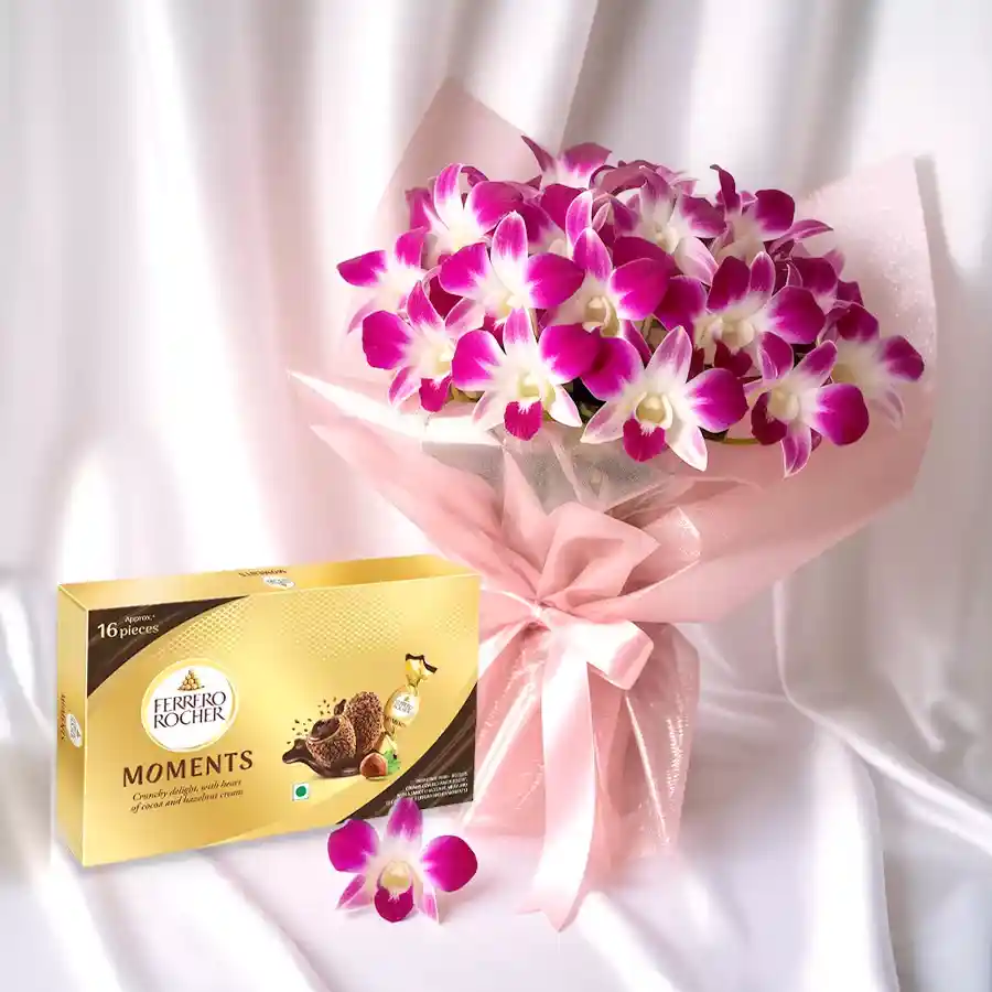 A stunning bouquet of 6 orchid stems with Ferrero Rocher chocolates, elegantly wrapped for Mother's Day.