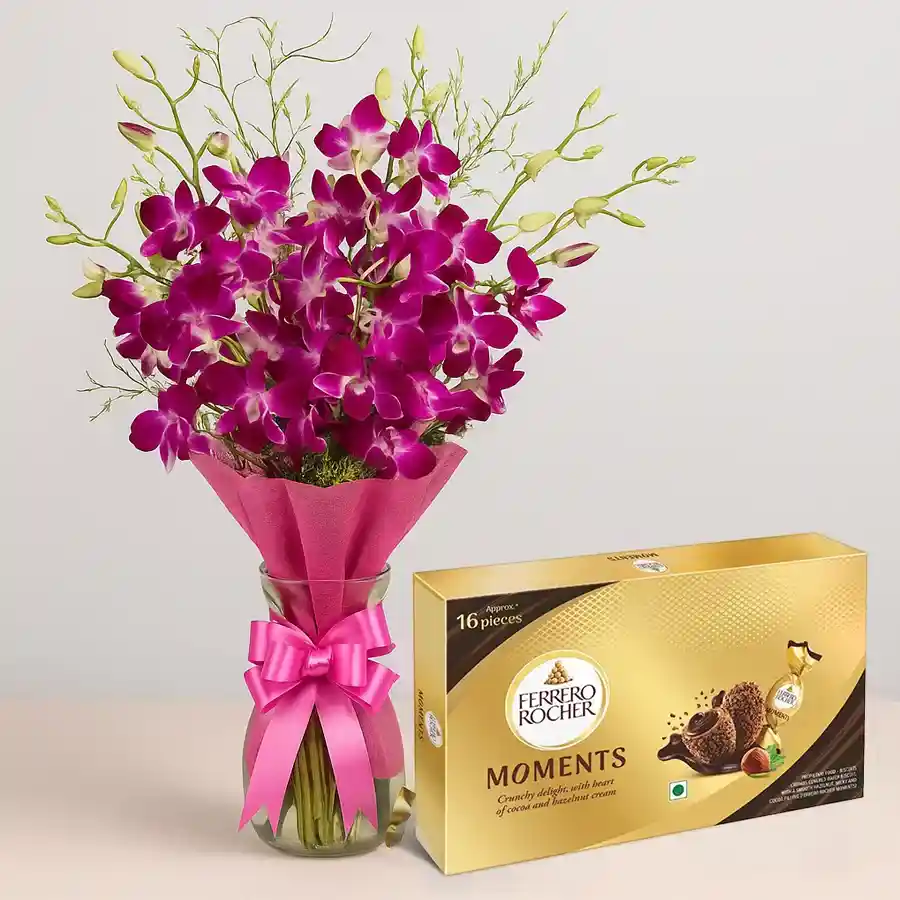 Artistic bouquet of 8 orchids with a box of 16 Ferrero Rocher chocolates, perfect for Mother's Day.