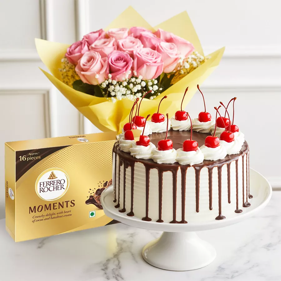 Mother's Day gift featuring a Black Forest Cake, pink roses, and Ferrero Rocher chocolates.