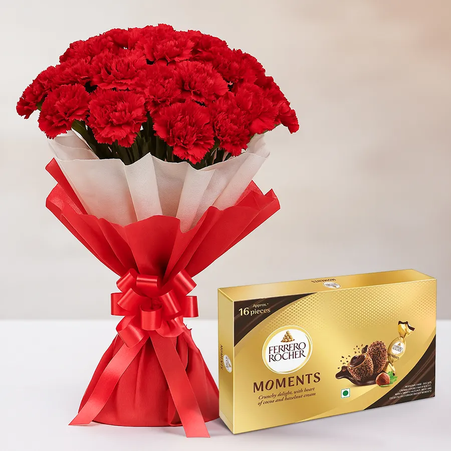 Gorgeous bouquet of red carnations paired with a box of Ferrero Rocher chocolates.