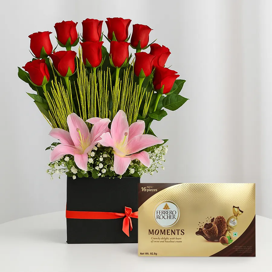 Gift box featuring 12 red roses, 3 pink lilies, and Ferrero Rocher chocolates.