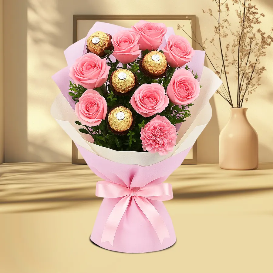Bouquet featuring pink roses and Ferrero Rocher chocolates, expressing love and affection.