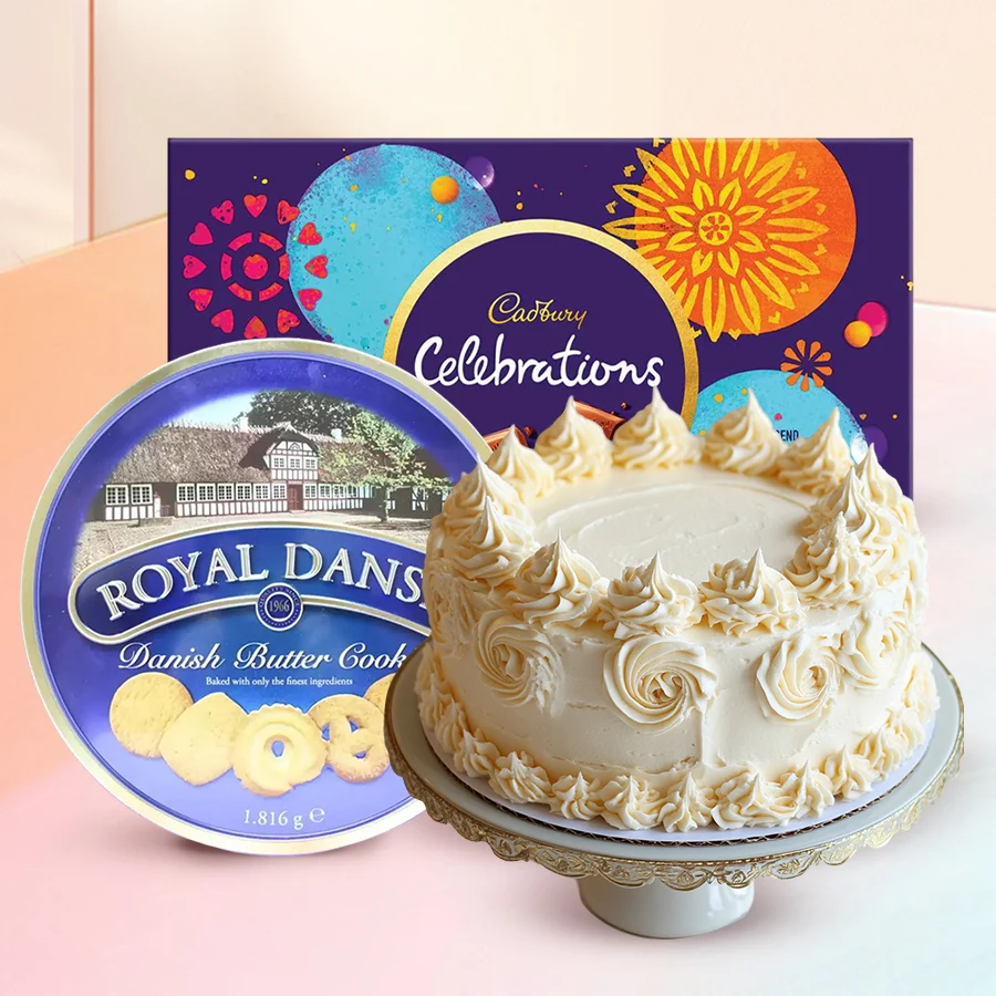 Tempting Treats Gift Trio featuring Cadbury chocolates, Danish cookies, and an eggless vanilla cake. Perfect for any celebration or indulgence.