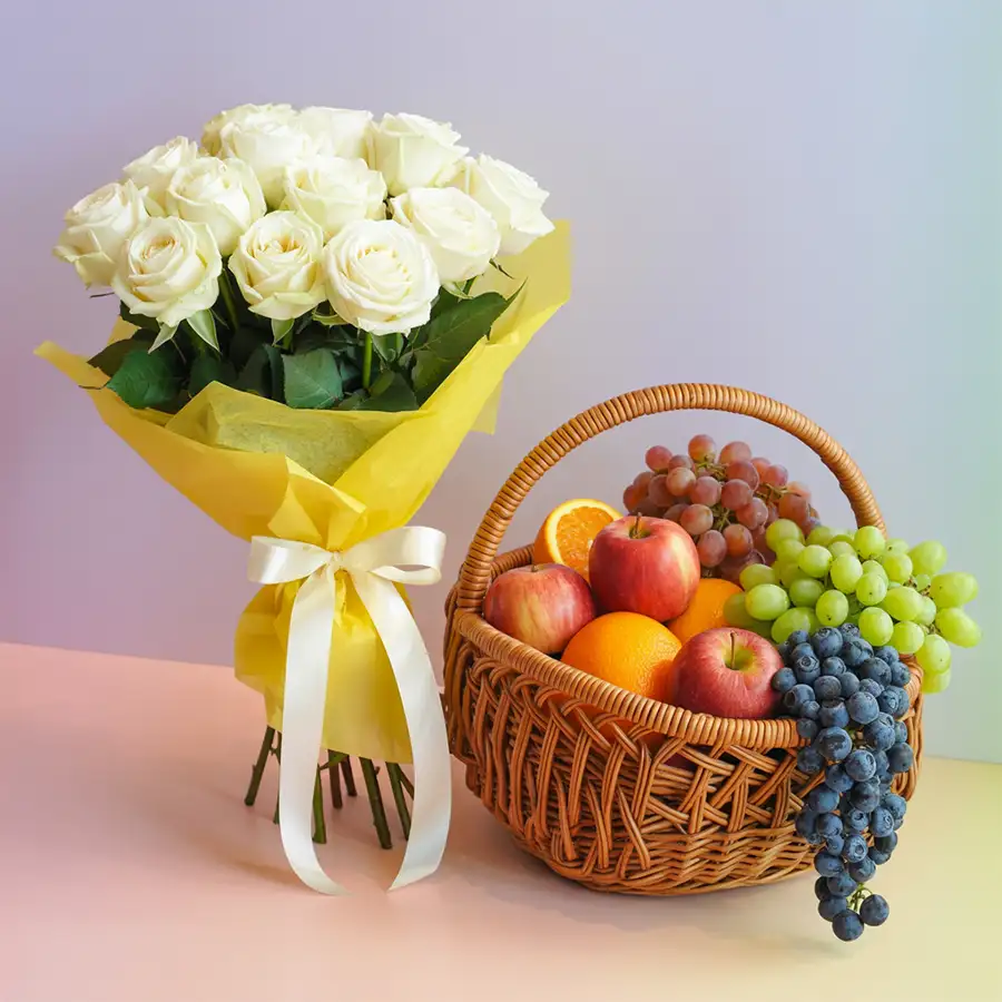 Elegant gift featuring a bouquet of 10 white roses and 5kg of fresh fruits, perfect for expressing sympathy and love.