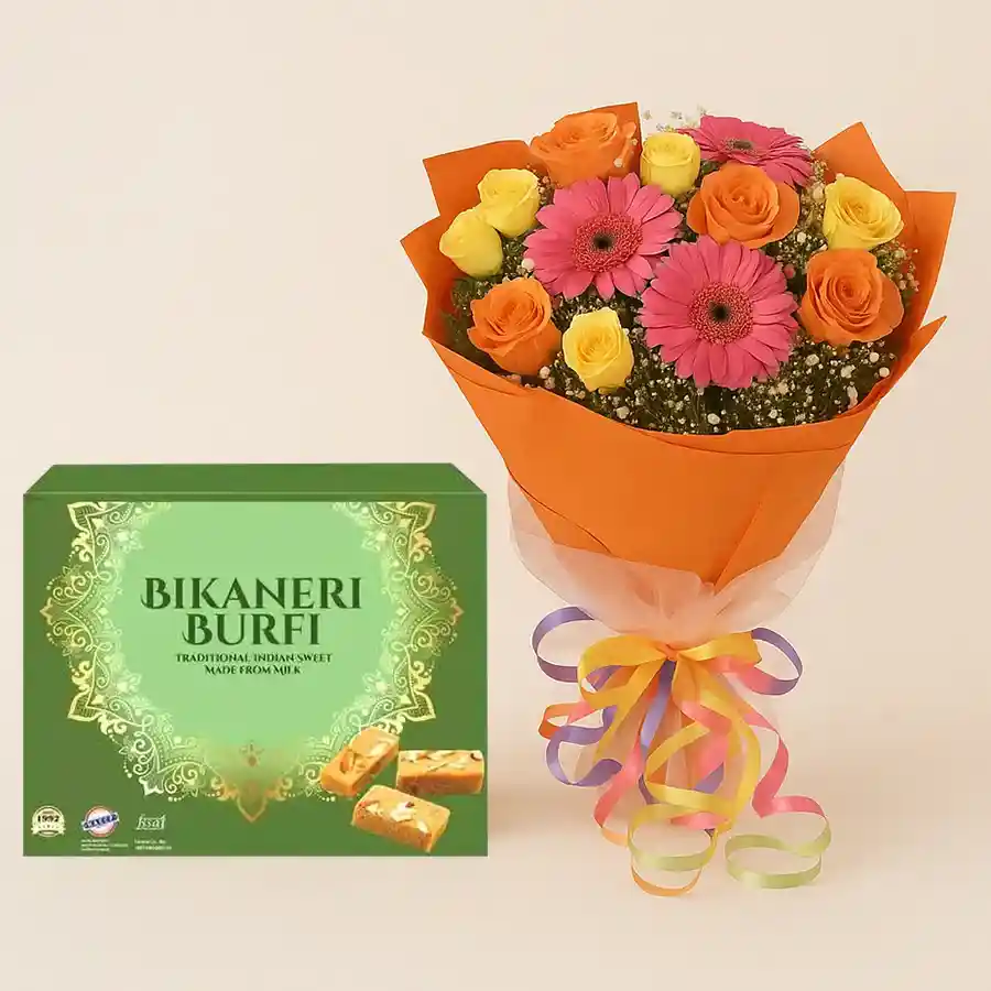 Alluring Bikaneri Burfi treats with a seasonal flower bouquet, showcasing a delightful gift set perfect for any occasion.