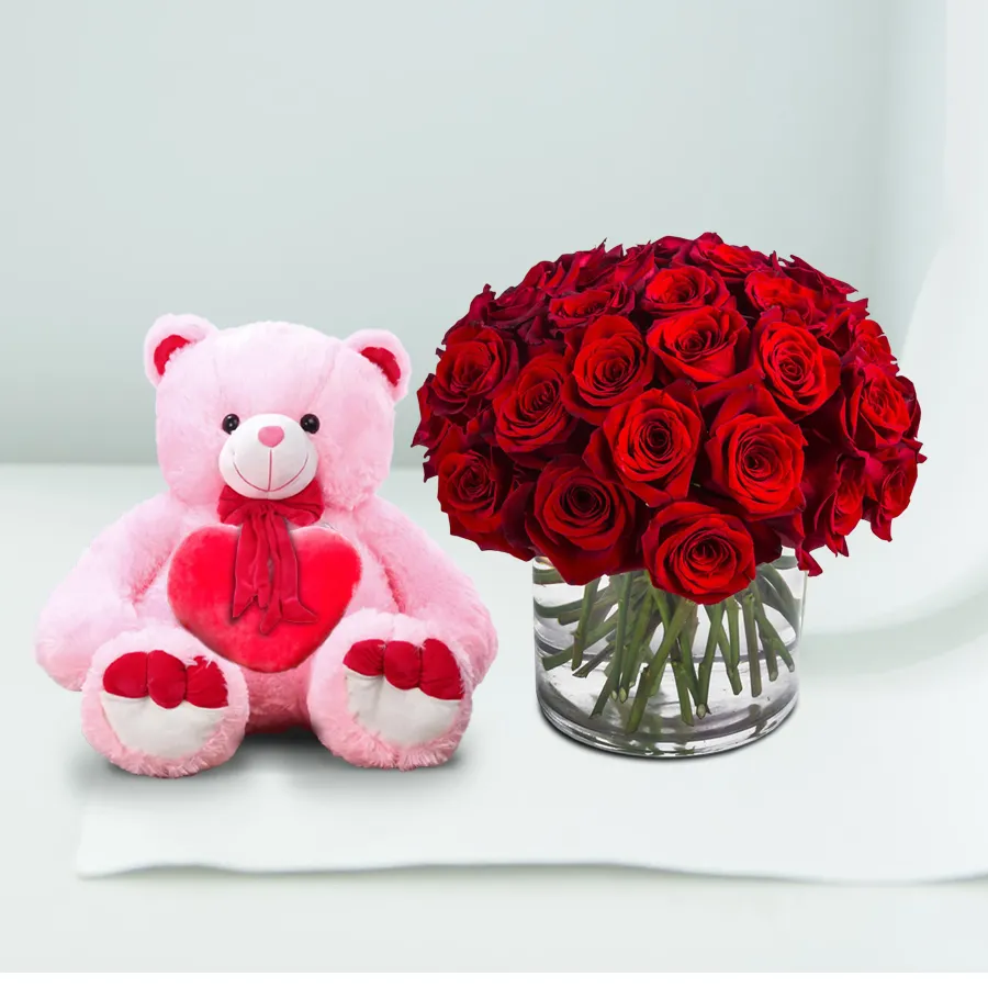 Romantic Rose and Teddy Delight gift set with red roses, glass vase, and a 10-inch teddy bear.
