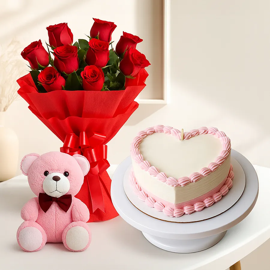Heart-shaped cake with teddy bear and Dutch roses in a vibrant gift combo.