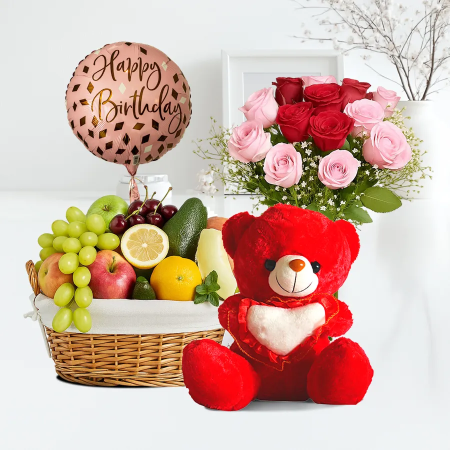 A vibrant 2 Kg Fresh Fruits Basket paired with colorful roses, Happy Birthday balloons, and a small teddy bear, perfect for birthday celebrations.