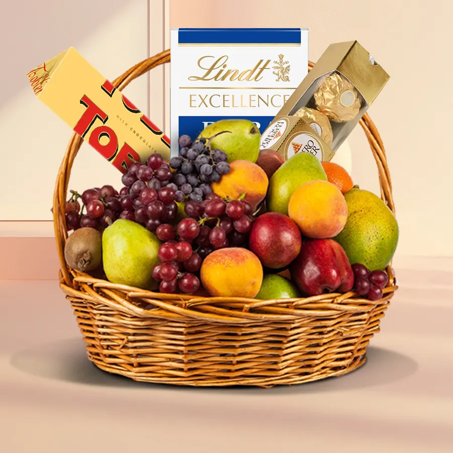 A lavish basket filled with fresh fruits and gourmet chocolates for special celebrations.