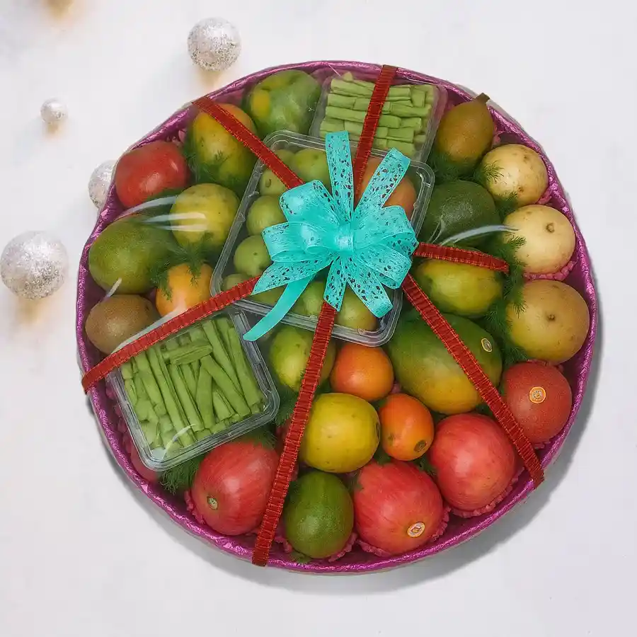 Seasonal Fruit Extravaganza Basket filled with fresh fruits like apples, pears, mangoes, strawberries, and more, beautifully arranged.