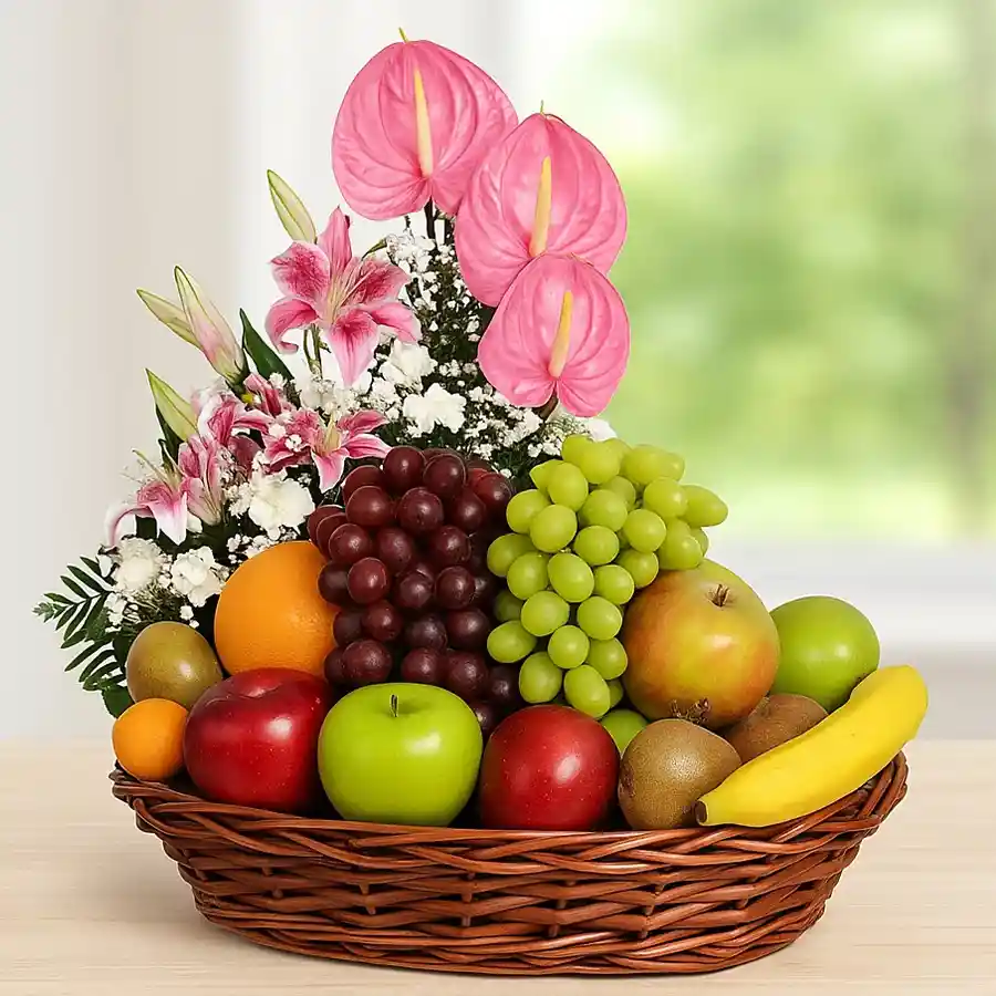 A vibrant basket featuring fresh fruits and colorful flowers, including Anthodium, Lily, and Carnations, designed to celebrate Mother's Day.