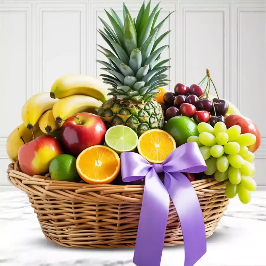 A beautiful Mother’s Day fruit basket filled with fresh apples, pomegranate, green grapes, pineapple, pears, and seasonal fruit like mango and oranges.