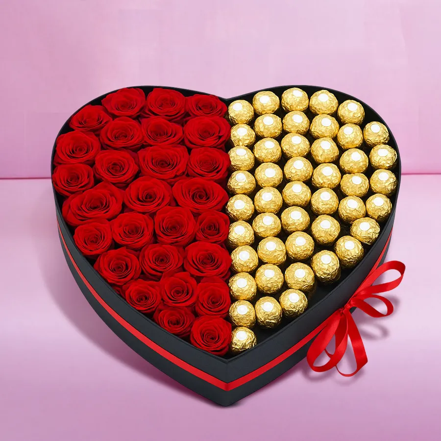 Heart-shaped box containing 24 red roses and 24 Ferrero Rocher chocolates for a romantic gift.