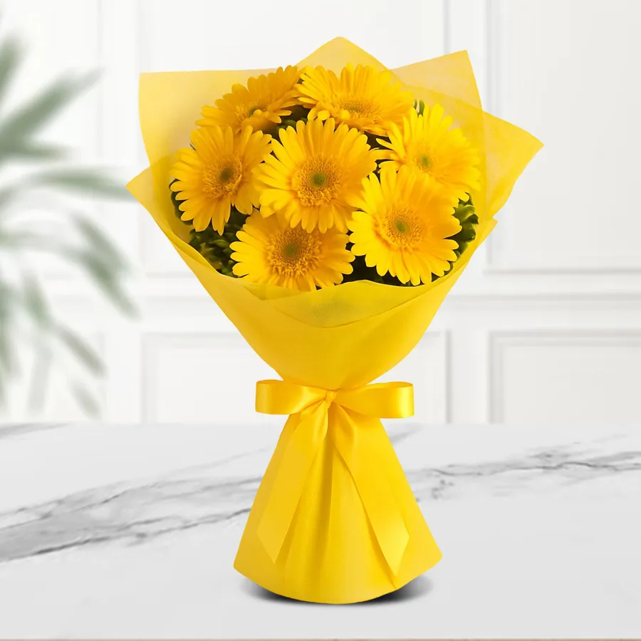 Sunshine Yellow Gerbera Delight bouquet featuring 10 yellow Gerberas and decorative fillers, elegantly wrapped in tissue paper.