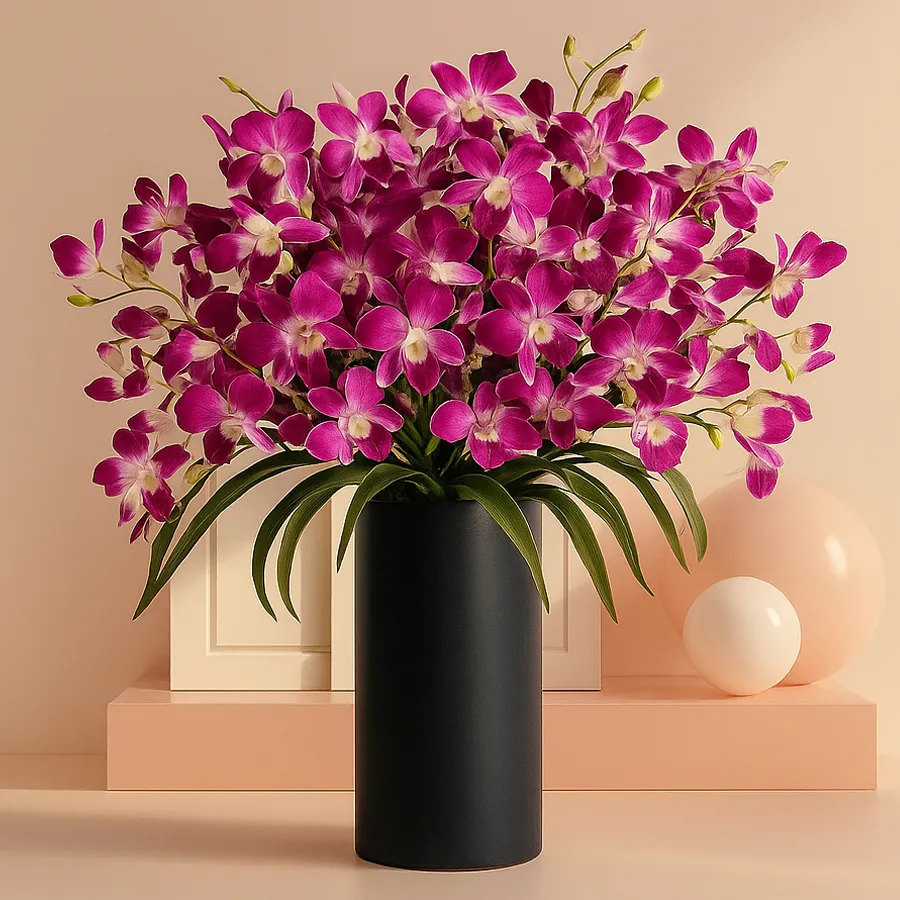 A dozen silky-smooth orchids elegantly arranged in a glass vase surrounded by vibrant greenery.