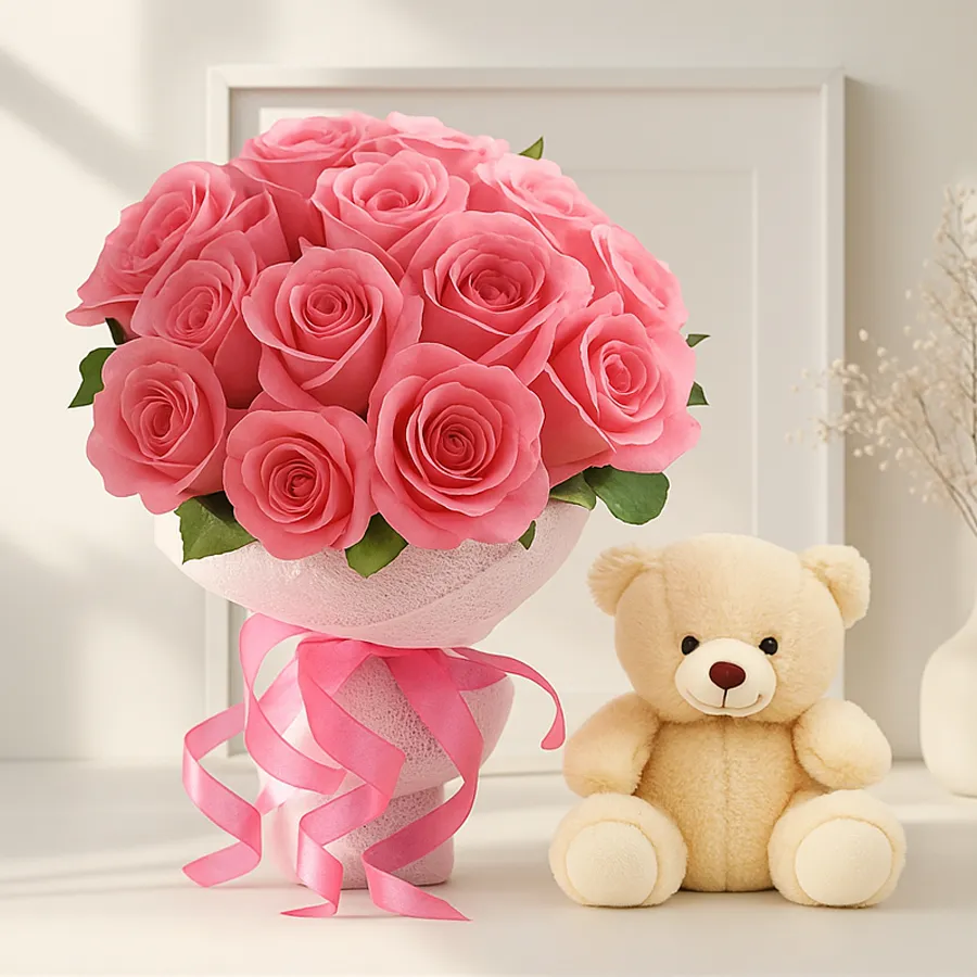A charming bouquet of 12 pink roses alongside a small teddy bear, ideal for gifting love and affection.