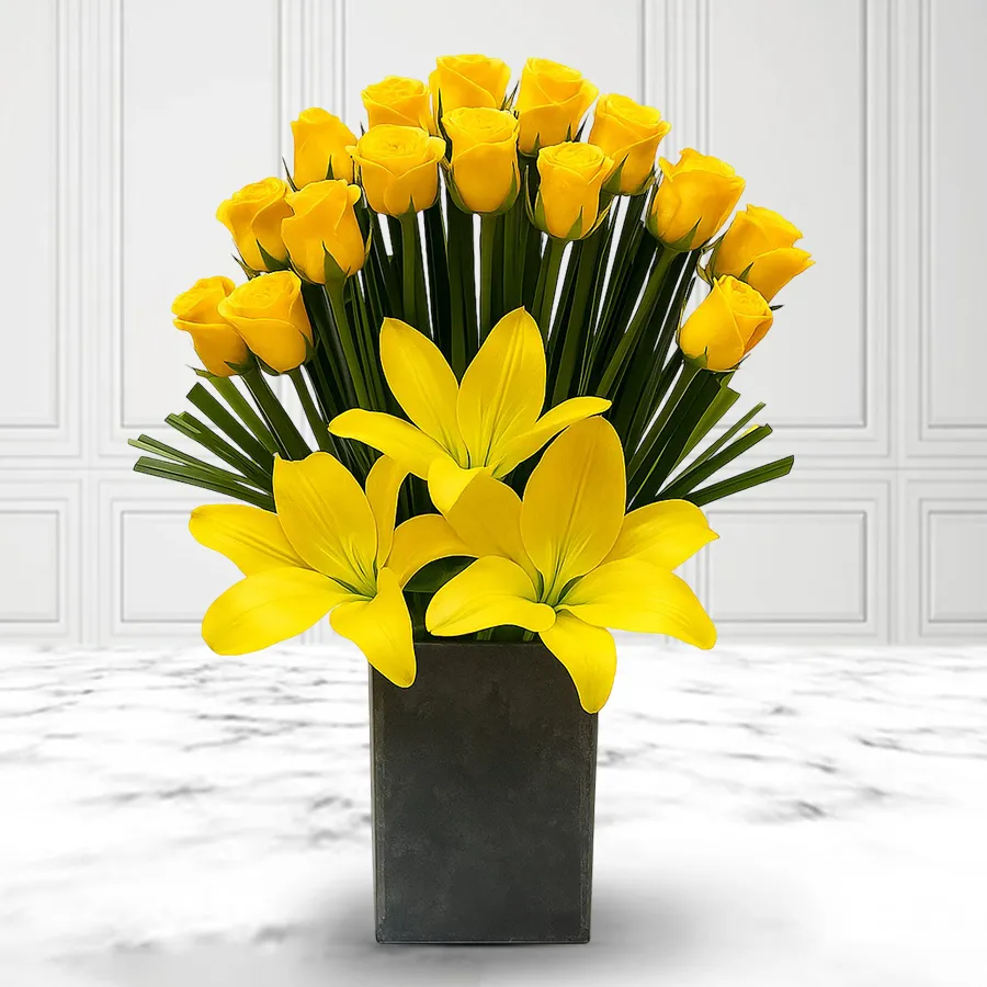 Vibrant arrangement of yellow lilies and roses in a lively display.