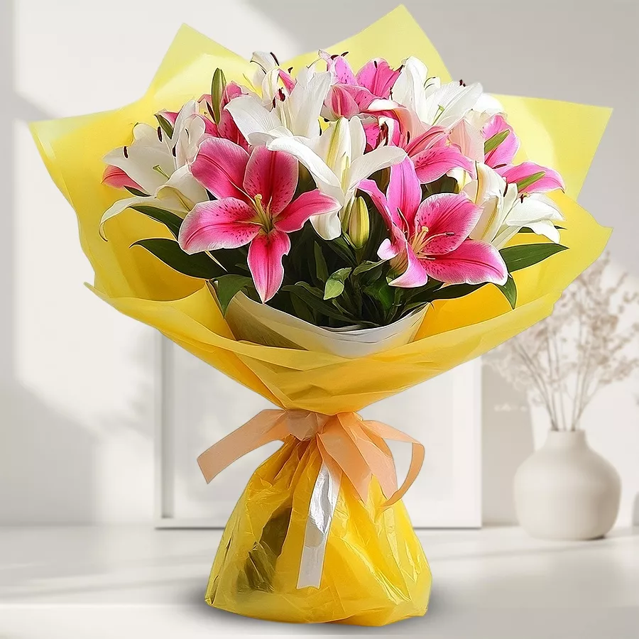 Charming arrangement of 10 pink and white lilies in a bouquet.