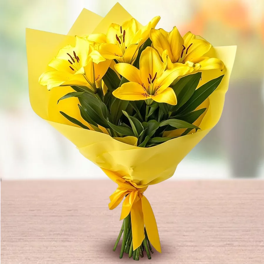A bouquet of five vibrant yellow lilies, symbolizing joy and affection.