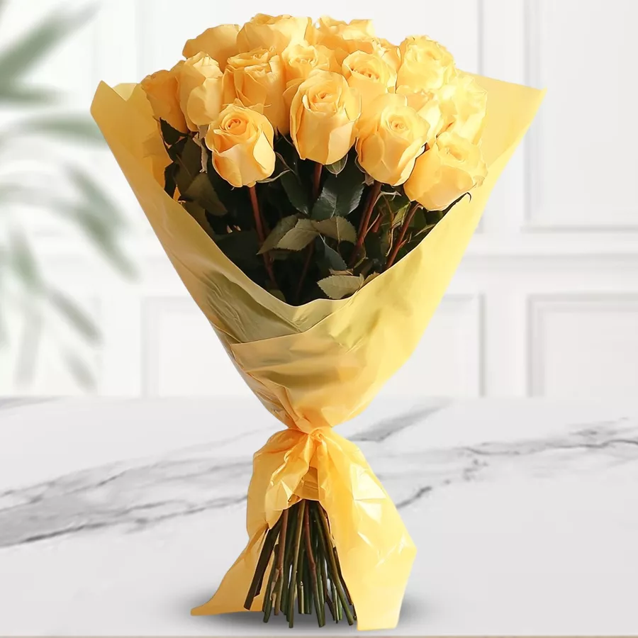 Bouquet of 25 cheerful yellow roses wrapped in tissue for celebrations.