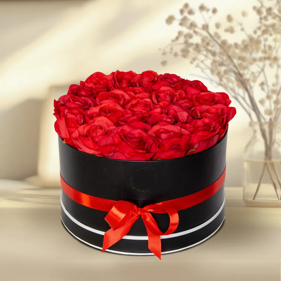 A chic black gift box containing 36 stunning red roses, perfect for expressing love.