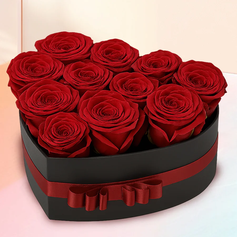Mesmerizing Love Box featuring 12 vibrant Dutch roses, elegantly arranged for a romantic gift.