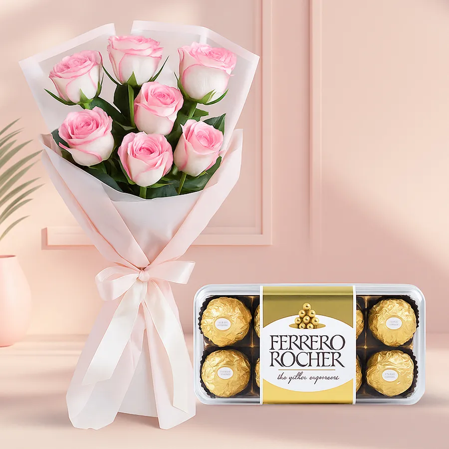Bouquet of 8 pink roses with 16 Ferrero Rocher chocolates, symbolizing love and indulgence.