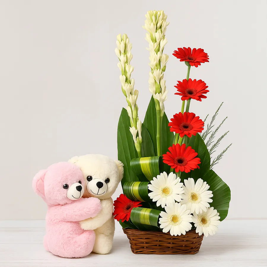 Adorable mixed flower arrangement with a cute teddy bear.