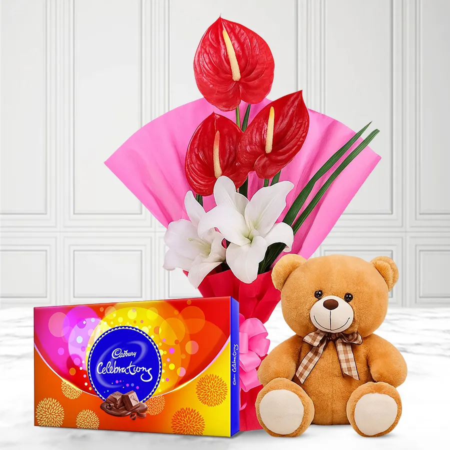 An adorable gift set featuring a flower bouquet, teddy bear, and chocolates, perfect for brightening someone’s day.