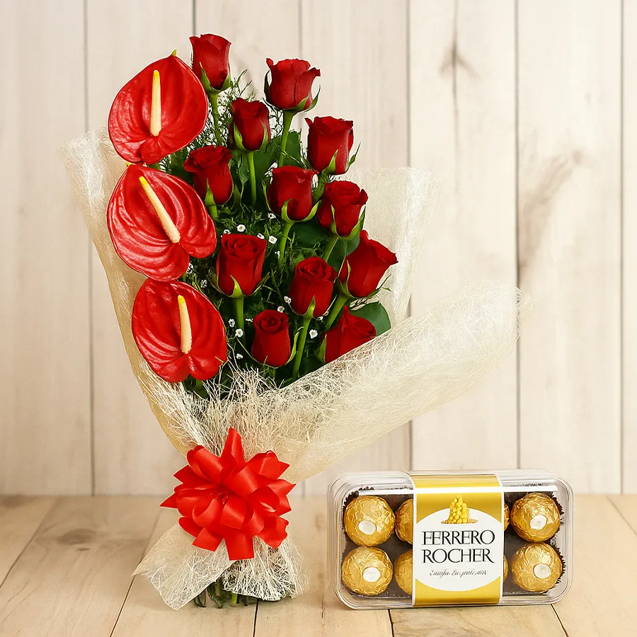 A stunning bouquet of red roses and anthuriums with Ferrero Rocher chocolates, perfect for gifting.