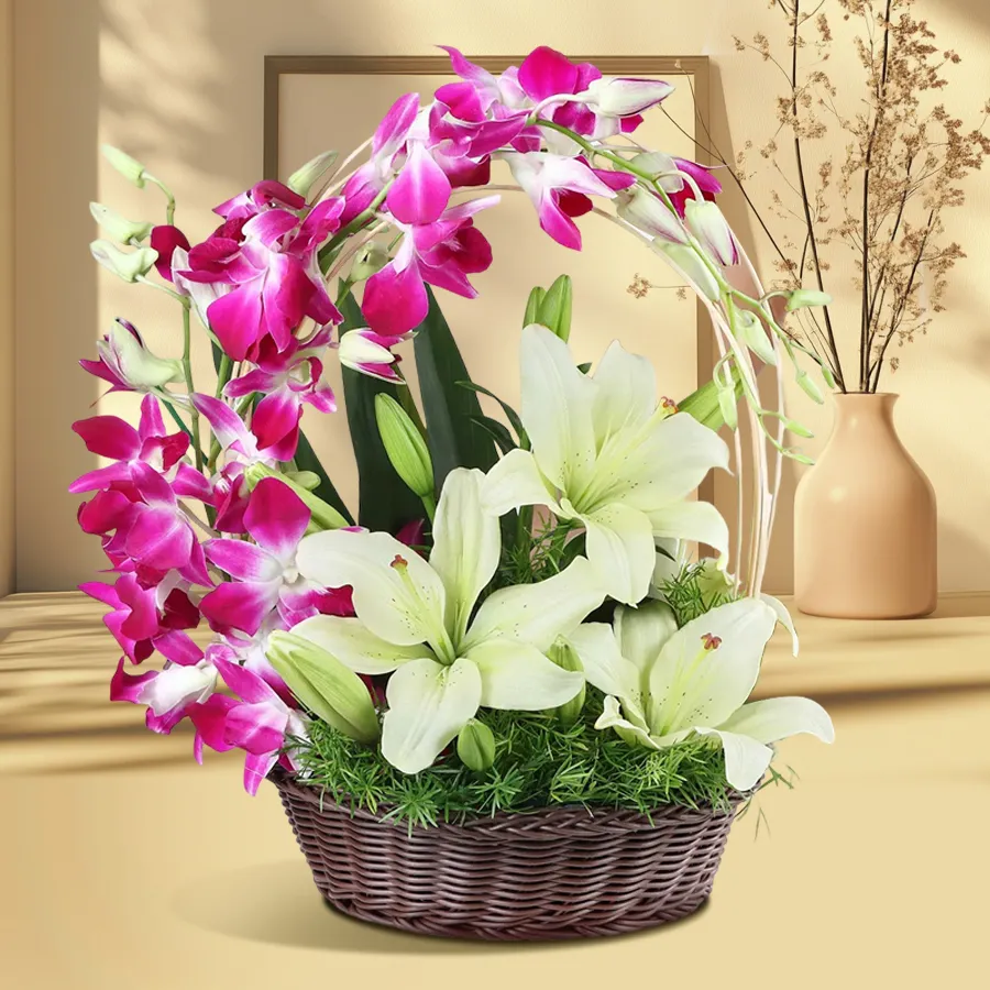 Elegant basket arrangement featuring blue orchids and white lilies, perfect for special occasions.