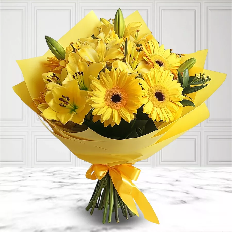 Bouquet featuring 6 yellow gerberas and 3 lilies wrapped in tissue paper, symbolizing warmth and appreciation.
