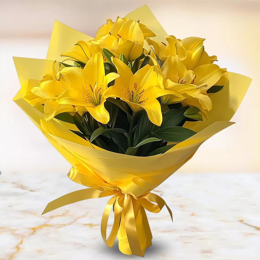 A vibrant bouquet of 10 yellow lilies wrapped in tissue, symbolizing joy and affection.