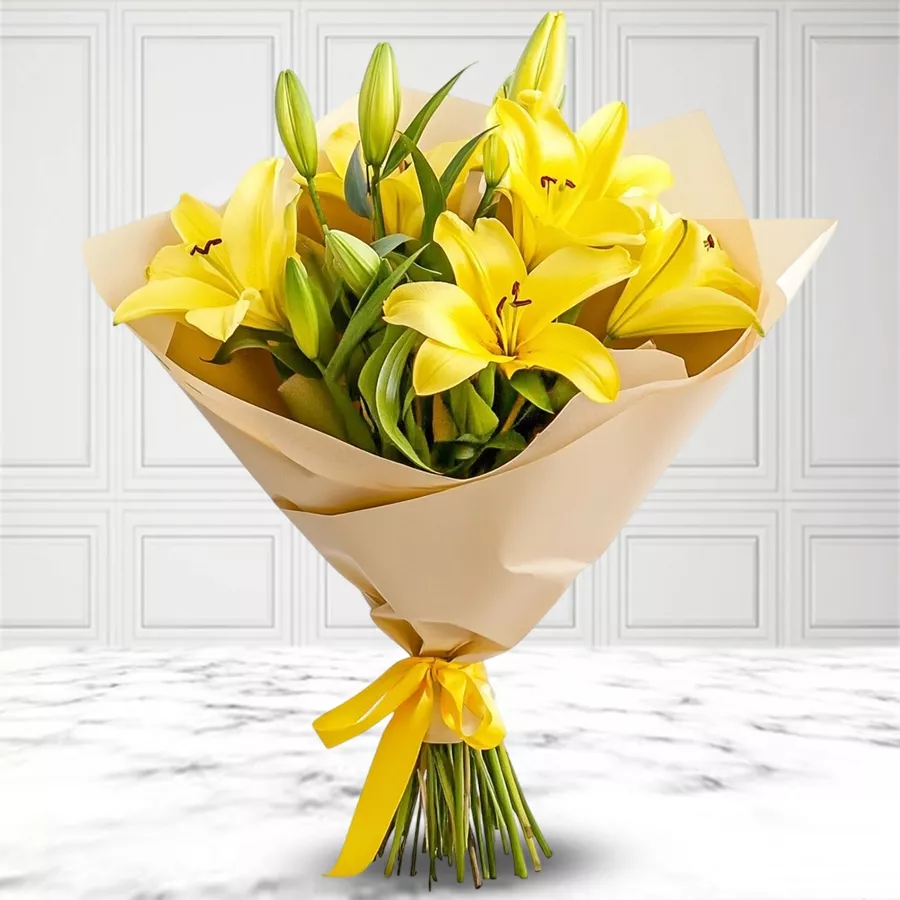Bouquet of 6 bright yellow lilies wrapped in tissue, radiating joy and warmth.