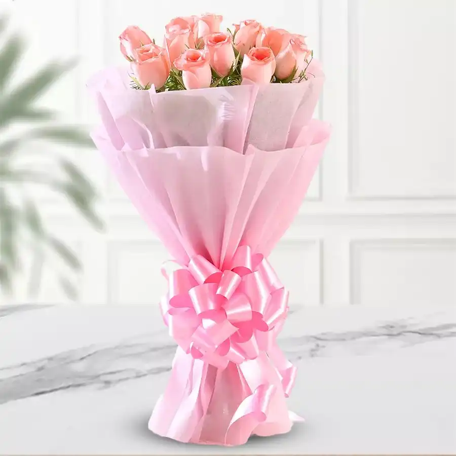 Bouquet of 8 pink roses wrapped in tissue, symbolizing love and affection.