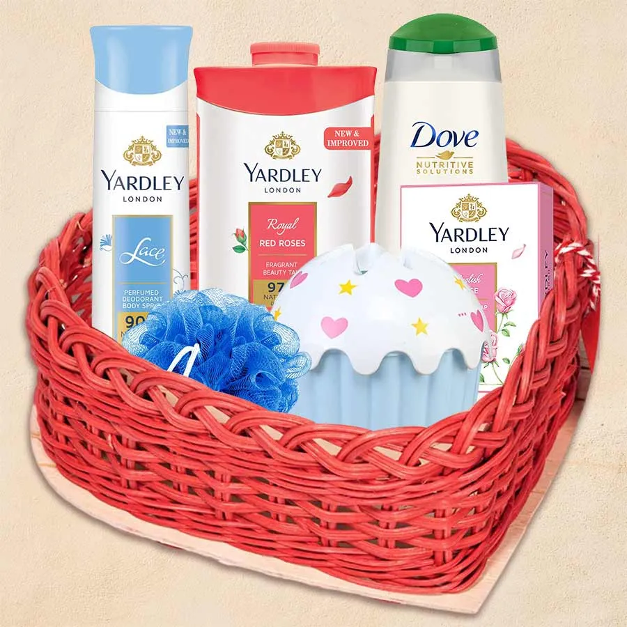 Wonderful Skin Care Gift Hamper featuring a heart-shaped basket filled with Yardley Powder, Yardley Soap, a cake-shaped napkin bin, Yardley Deo, Dove Shampoo, and a scrubber.