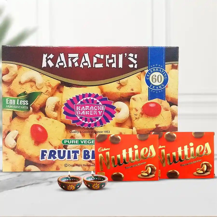 Karachis Fruit Biscuit festive box with Cadbury Nutties and decorated diyas for Diwali celebrations