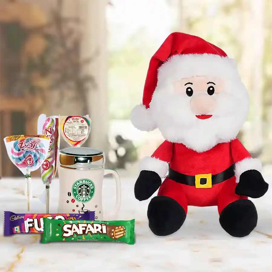 Christmas Gift Hamper filled with Santa Claus soft toys, a Starbucks coffee mug, Zuby candies, a Safari chocolate bar, and a Cadbury Fuse bar.