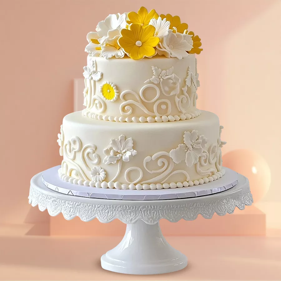 A vibrant two-tier wedding cake beautifully decorated with bright yellow flowers, perfect for weddings and special occasions.