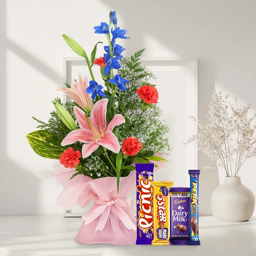 Seasonal flowers arrangement with assorted Cadbury chocolates for a delightful gift combo.