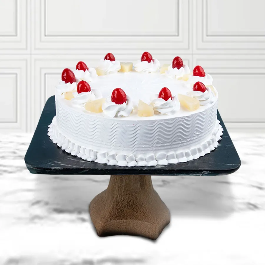 A 1 kg Irresistible Pineapple Cake from 5 Star Bakery, beautifully decorated and ready for celebration.