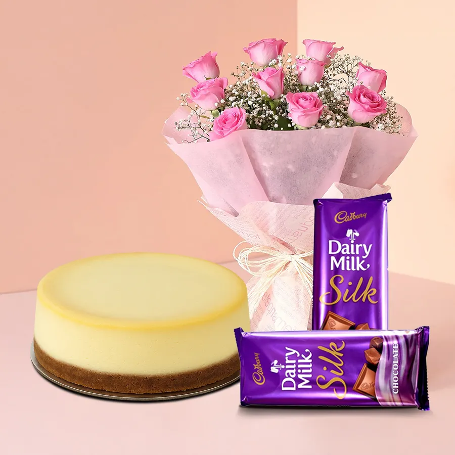 Sumptuous cheesecake with pink roses and Cadbury chocolates from 5 Star Bakery. Perfect gift for expressing love and affection.