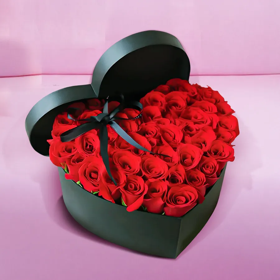 Heart shaped arrangement featuring 20 vibrant red roses, symbolizing love and affection.