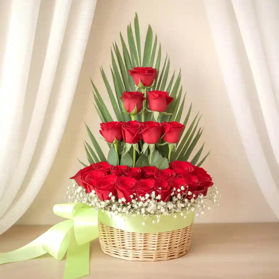 Heartfelt Gift Basket with 18 Red Dutch Roses and greens for Mother's Day.