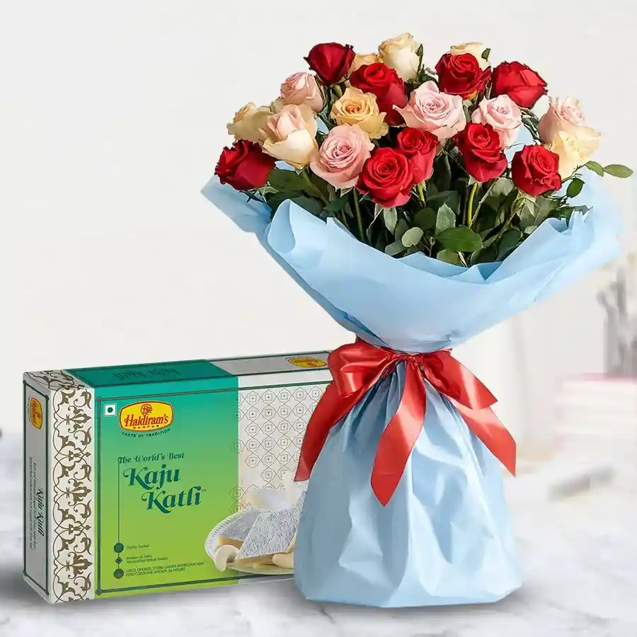 Bouquet of mixed roses with 1 Kg of Kaju Barfi, ideal for celebrations.