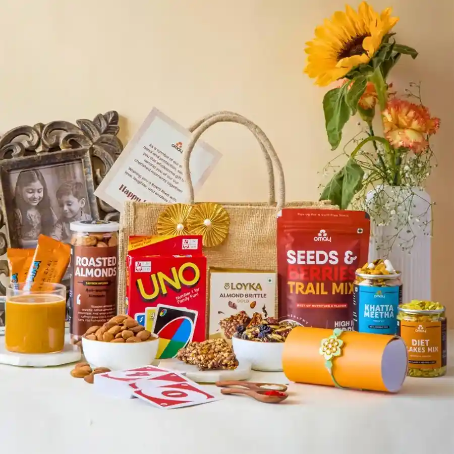 Sibling Bond Delight Gift Bag featuring treats, a rakhi, and a premium jute bag for Rakhi celebration.