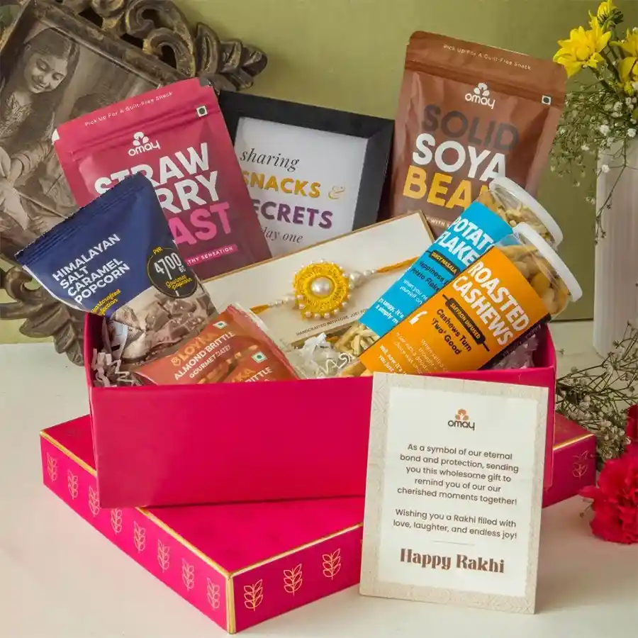 Cherished Rakhi Celebration Gift Hamper featuring gourmet treats, custom photo frame, and handmade Rakhi in a premium gold box.