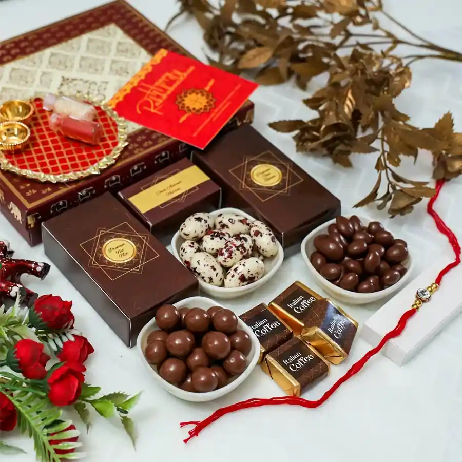 Rakhi Chocolate Assortment with Stone Rakhi, chocolates, Pooja Thali, and more for a memorable Raksha Bandhan celebration.