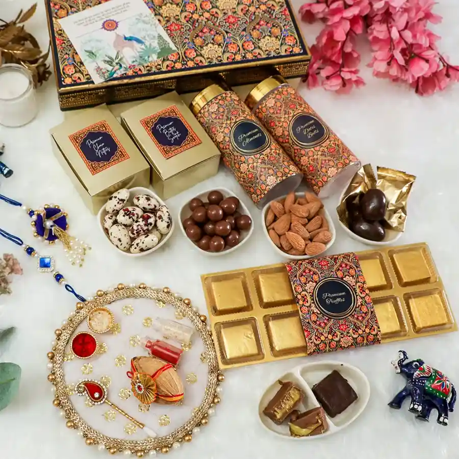 Festive Delight Rakhi Collection featuring a Blue Stone rakhi, premium chocolates, and Pooja Thali for Raksha Bandhan celebrations.