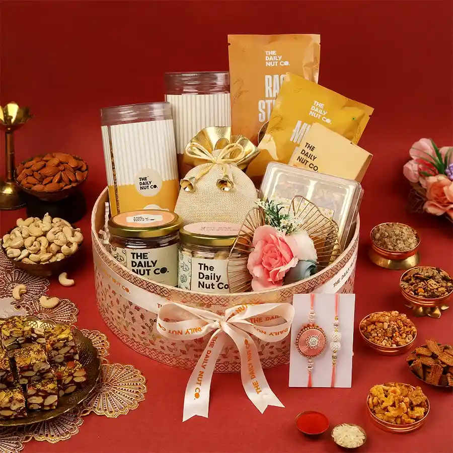 Sweet Nutty Delights Rakhi Pack featuring roasted nuts, crunchy snacks, and delightful sweets, perfect for Raksha Bandhan celebrations.